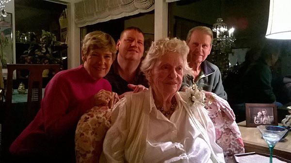 Marie Martin (center) surrounded by family in her Kenmore home on her 100th birthday.