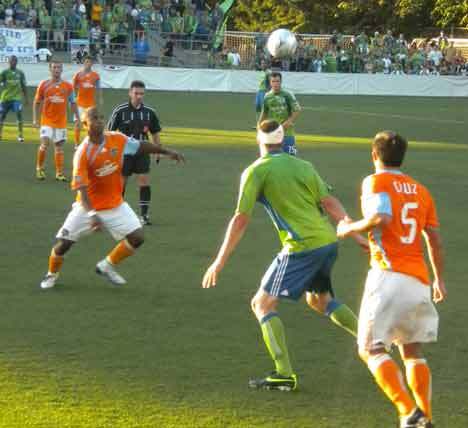 Sounders’ forward Nate Jaqua (with head bandage) anticipates the ball during the U.S. Open Cup semifinals against the Houston Dynamo July 21 at Starfire Complex in Tukwila.