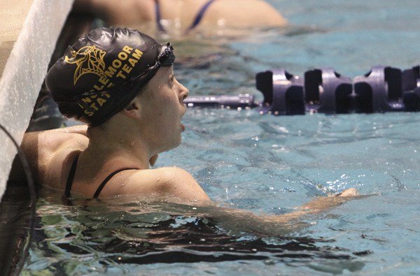 Inglemoor's Sage Speak looks up at the board and discovers she has won the 2011 4A state breaststroke championship.