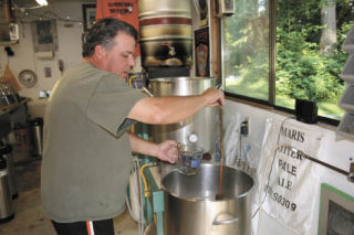 Jim Jamison brews up a batch of his Foggy Noggin beer in his unincorporated Snohomish County garage. TOM CORRIGAN
