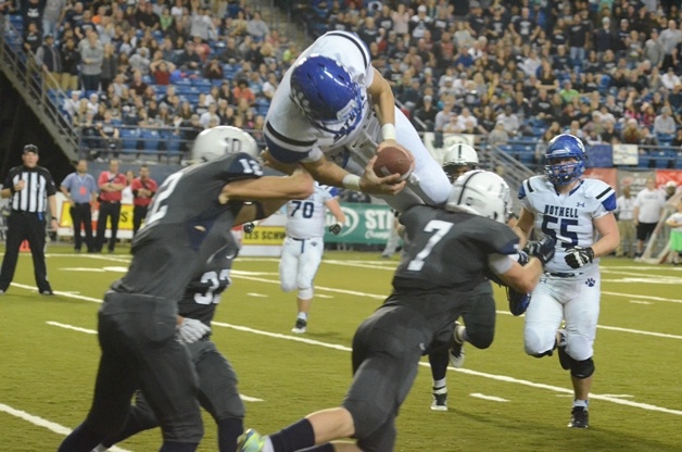 Bothell quarterback Ross Bowers flips into the end zone as the Cougars took a 24-7 lead against Chiawana.