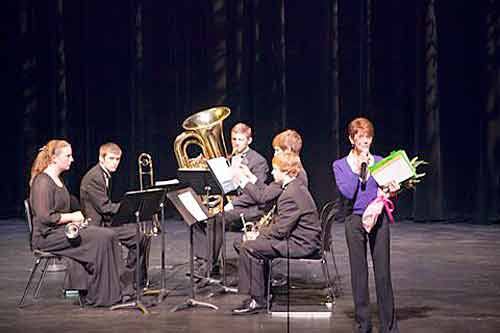 Bothell High School music teacher Sheri Erickson introduces the band performers during the 2012 Comfy Concert at the Northshore Performing Arts Center.