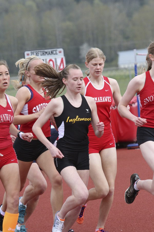 Tansey Lystad leads the pack in the 3200 meters at last weekend’s Tomahawk Classic. She holds the best 4A time in that event in the state - 10 minutes