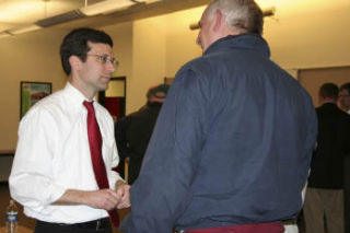 King County Councilman Bob Ferguson chats with a local community member after a town-hall-style meeting on a proposed water-taxi route between Kenmore and Seattle.  Courtesy photo