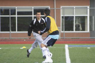 Bothell High junior Yordan Rivera dribbles the ball around a teammate in a six-on-six match in practice last week. ANDY nystrom