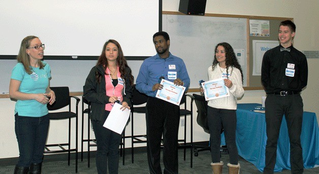 Kristin Jones awarding the winning group the Unbreakables for their App Challenge Idea. Team Unbreakables members included Jacqueline Flores-Barranco