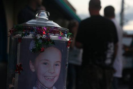 Rachel Beckwith is pictured on a donation jar outside Liquid Lime in Kirkland