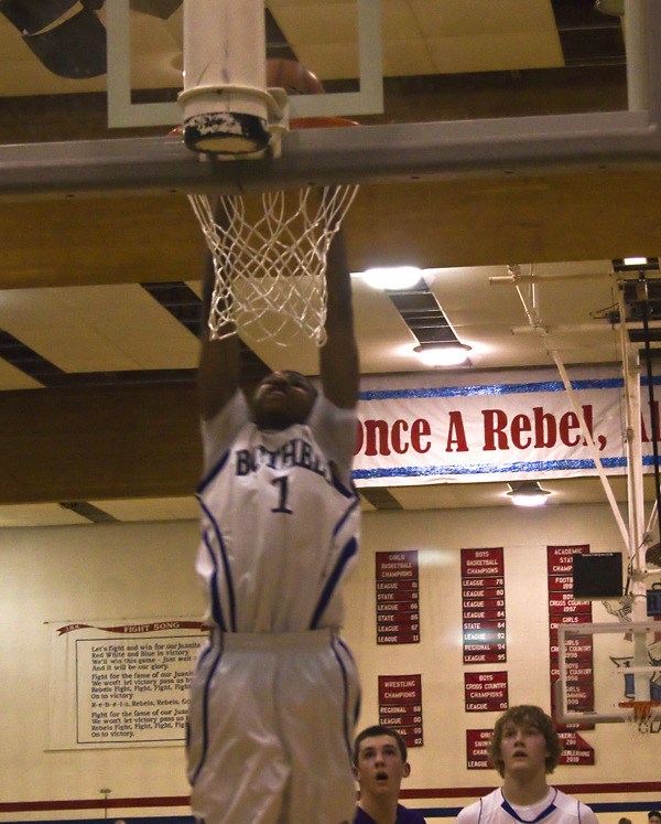 Bothell guard Perrion Callandret slams down a two-handed dunk against Issaquah on Friday night. Callandret led the Cougars with 23 points in a 67-54 Kingco Semifinals loss to the Eagles
