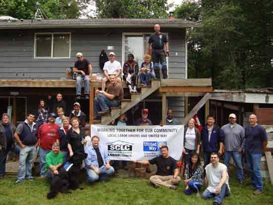 Almost two dozen volunteers from United Way of Snohomish County and local labor unions and helped Darold Thomas (seated in front row