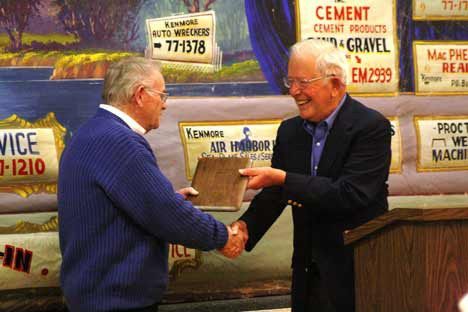 Les 'Bud' Eaton (left) receives a plaque for the McMaster Heritage Award for 2011 from Kenmore Heritage Society President Elmer Skold at Wednesday night's event at the Kenmore Community Club.