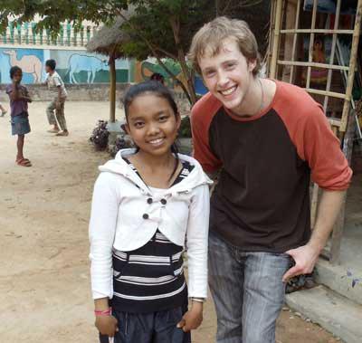 Cedar Park Christian graduate Kenny King with a Cambodian student.