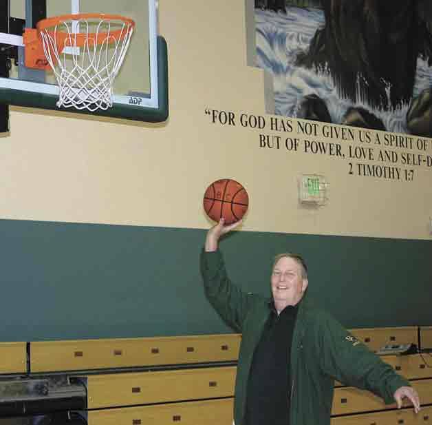 Alan Dickson goes to the hoop at Bear Creek School. He's the new Cedar Park Christian girls varsity coach.