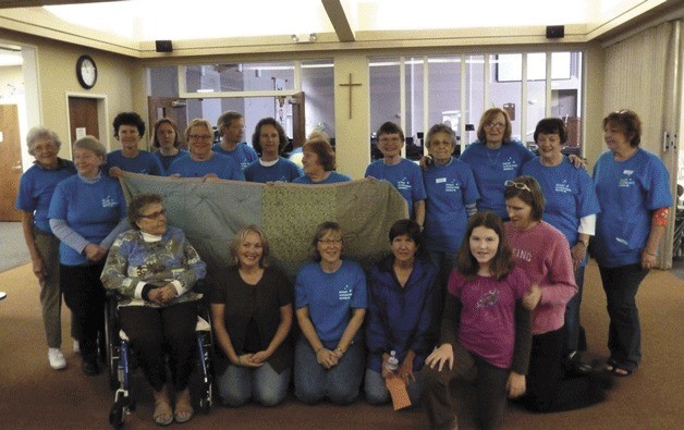 Epiphany Lutheran Church in Kenmore will hold its annual Day of Service on Sept. 14. Last year this group made quilts to donate to local outreach groups.