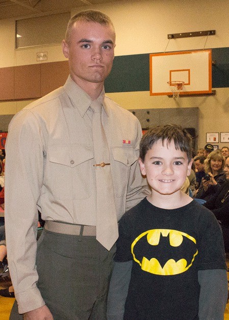 Mathew and Bryson Stevens pose for a happy photo after the surprise visit from Mathew at the Arrowhead Elementary School's Veteran's Day Assembly.