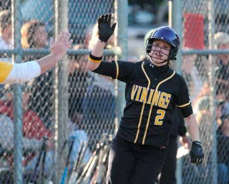 Inglemoor High's Taylor Peacocke celebrates a home run during last week's 4A Kingco playoffs. The Vikings won the league title.