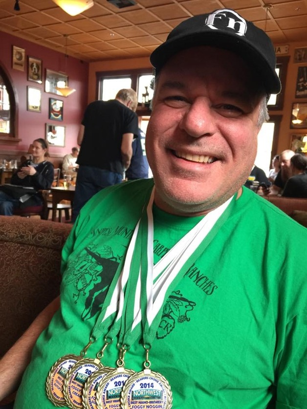 Bothell's Foggy Noggin Brewmaster Jim Jamison shows off his readers' choice awards.