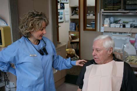 Dr. Wendy Crisafulli speaks with patient Weldon Johnson