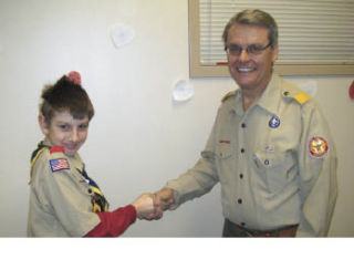 Boy Scout Carl Worthey meets with executive Wayne Brock. COURTESY PHOTO