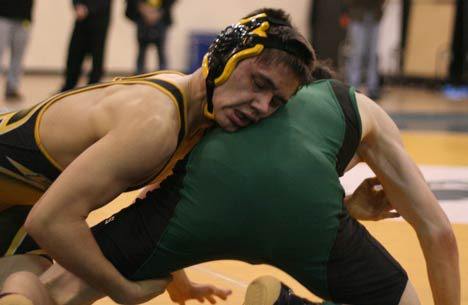 Inglemoor High's Ian Bedo grapples with Skyline High's Michael Mecham at 140 pounds in their opening-round bout at the 4A Kingco tournament Friday afternoon at the Juanita High Fieldhouse. Bedo won by pin.