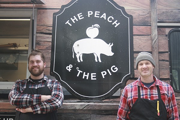 Jason Unger and Nate Allen (right) outside their food truck