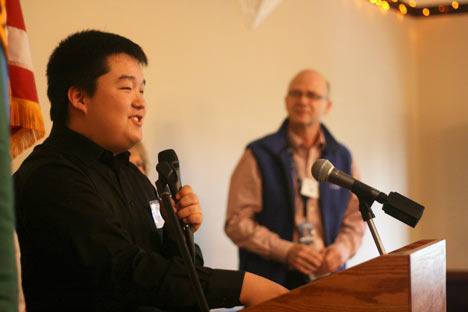 Bothell High’s Jonathan Kwon speaks to the crowd after being named the Greater Bothell Chamber of Commerce’s student of the month at its Jan. 11 meeting. Bothell High instructor Duane Eickhoff (right) spoke about and introduced Kwon to the crowd. Kwon received a $25 gift card to the University Book Store from the University of Washington