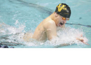Inglemoor High’s Luke Swenson swims the breaststroke leg of the 200-yard individual medley last Saturday at state. MATT BRASHEARS