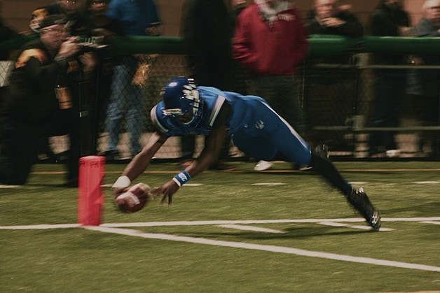 Bothell's Dayzell Wilson dives for the end zone during the Cougars win against Ingelmoor Friday at Pop Keeney Stadium in Bothell.