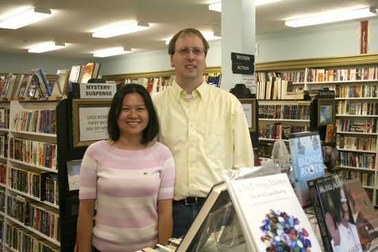 Jason and June Bailey show off the brightly lit interior of the new JJ Books in Bothell's Country Village. The store launched in July.
