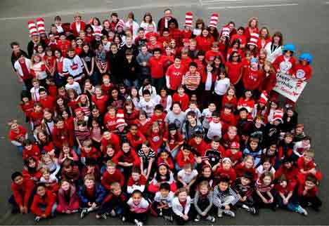 Red and white  were the colors of the day for students at Kenmore’s Arrowhead Elementary School recently as they marked Read Across America Day