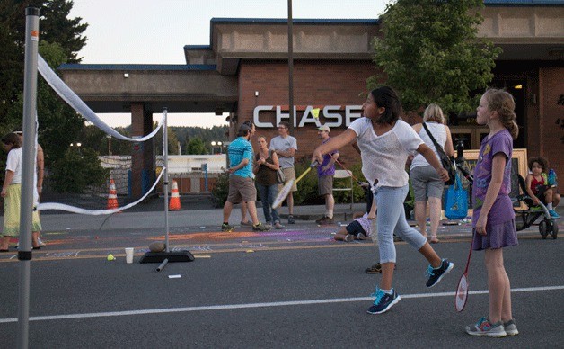 Local Kenmore kids play badminton in the street during Kenmore’s summer party at Kenmore Village.