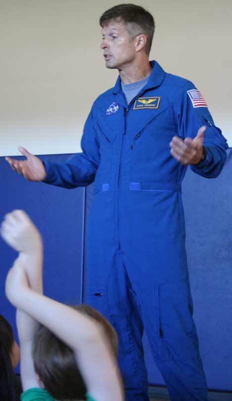 Astronaut Steven R. Swanson answers questions about his recent space-shuttle mission on STS-119 Discovery from Evergreen Academy students Friday morning. He encouraged the Bothell students to study math and science in order to become astronauts like him. On his mission — during which he and his fellow astronauts placed equipment on the space station — he noted: 'Sometimes