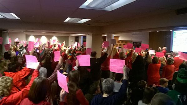Paraeducators make a show of force at the Dec. 8 Northshore Board Meeting in support of increasing wages and hours.