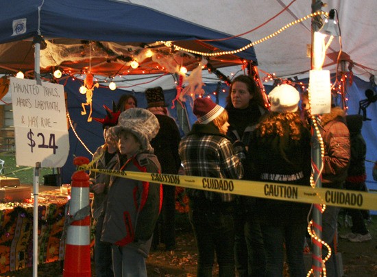 Visitors wait in line last year for a trip through Bastyr's Haunted Trails.