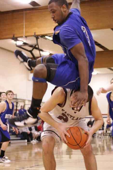 Bothell High's Dominic Ballard lands on top of Eastlake High's Michael Russo during Thursday night's 4A Kingco tournament game.