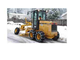 Bothell workers grade the streets during the recent storm.