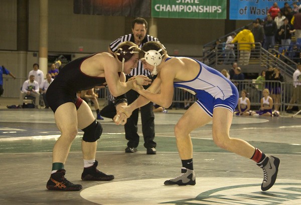 Bothell High's Brandon Davidson (right) squares off against Trevor Anderson of Bethel in the 152-pound 3rd/4th place finals at the Tacoma Dome's Mat Classic on Saturday. Davidson scored the deciding point on a last-second escape to win