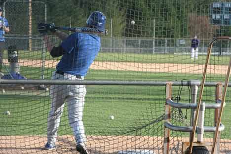 Bothell High’s Anthony Minor raps the ball toward the outfield during practice last week.