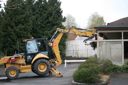 Sitting in the cab of a backhoe