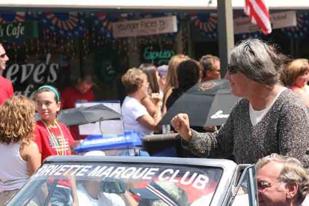 Former Bothell Mayor Sue Walsh waves to the crowd during last year's Grand Parade.