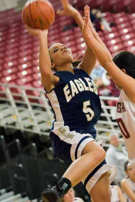 Cedar Park Christian's Mikaela Raschick drives to the hoop during Wednesday's 1A state-tournament game against Okanogan at the Yakima SunDome.