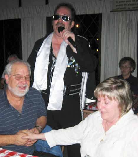 Bothell Post #127 American Legion hosted its annual Elvis dinner concert Jan. 30 and raised $907 for the Children's Miracle Network through Children's Hospital. Pictured with Elvis (Dave Tarvell) are Mike and Linda Adkins on their anniversary.