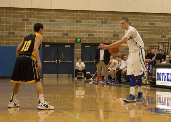 Bothell guard Zach LaVine faces off with Inglemoor’s Chris Bryant during Tuesday night’s 58-56 Cougar basketball win. LaVine finished with a game-high 20 for Bothell