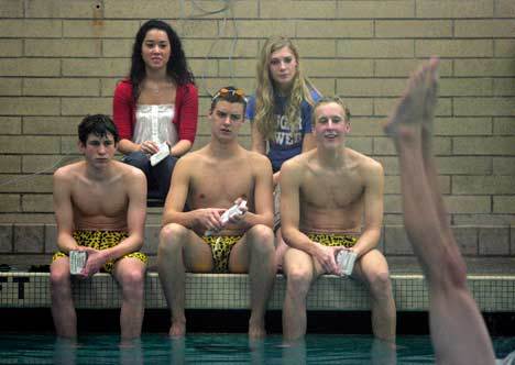 Inglemoor High swimmers judge the diving competition at a meet last year at the Ruiz-Costie/Northshore Pool.