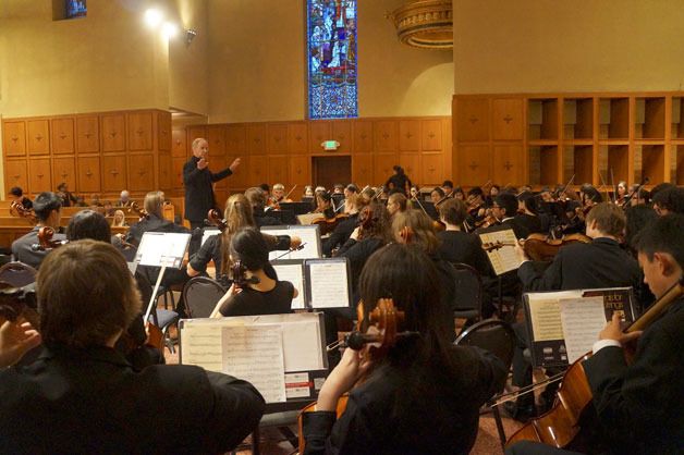 Inglemoor High School music teacher Jim Rice conducts the Viking orchestra at Bastyr University in Kenmore last month. The group was selected to play at the famous Carnegie Hall and Lincoln Center’s Avery Fisher Hall next year.