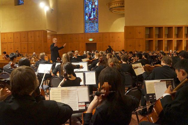 Inglemoor High School music teacher Jim Rice conducts the Viking orchestra at Bastyr University in Kenmore last month. The group was selected to play at the famous Carnegie Hall and Lincoln Center’s Avery Fisher Hall next year.