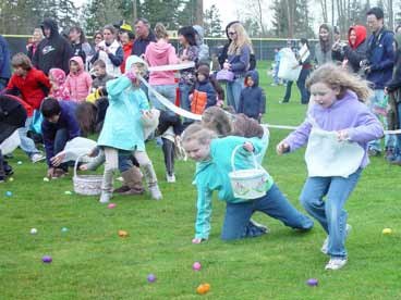 Children race to grab plastic eggs at last year's Easter hunt at Inglemoor High.
