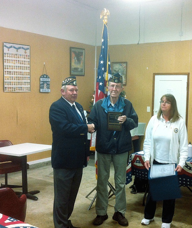 Carl Wipperman receives the Legion Award of Merit from Burt March
