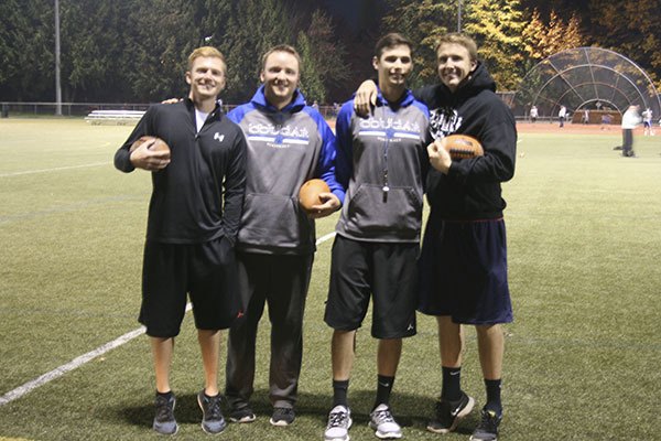 Four of the six coaches as they set up for practice.