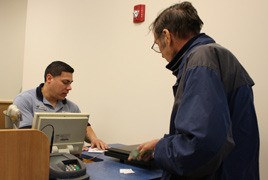 Kenmore resident James Brooks was the first customer at the new Kenmore branch of the United States Postal Service office (6531 N.E. 181st St.)
