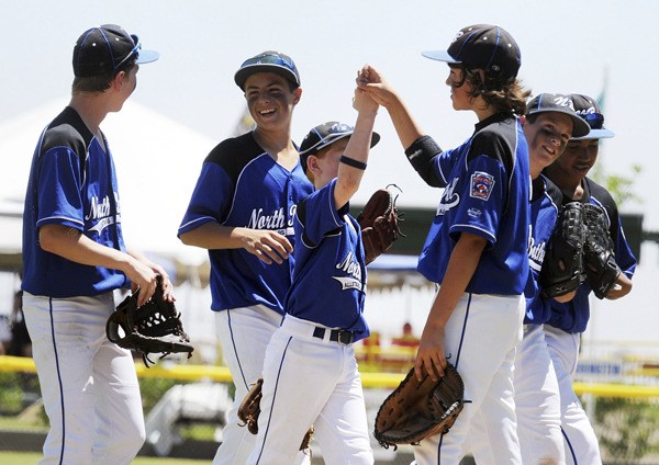 North Bothell Little League players celebrate after beating Wyoming